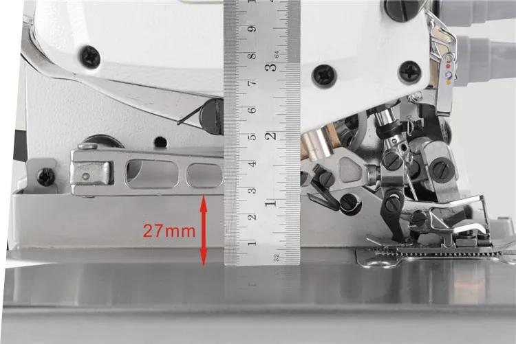 Dixie Tailoring Supply Close-up of the Jack E4 Industrial Overlock/Serger Sewing Machine with a metal ruler showing a 27mm measurement, highlighted by a red arrow. Tailoring Supplies