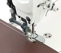 Dixie Tailoring Supply Close-up of a JAPANFUJI DU 1181 BRAND NEW WALKING FOOT SEWING MACHINE stitching brown fabric. Tailoring Supplies