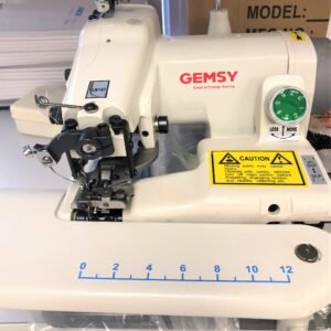 Dixie Tailoring Supply The GEMSY BLIND STITCH PORTABLE SEWING MACHINE is perfect for tailor shops, featuring multiple controls and a caution label. Tailoring Supplies