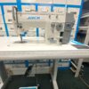 Dixie Tailoring Supply The JACK 20U Zig Zag Industrial Sewing Machine, paired with a sturdy table and surrounded by drawers, creates the ideal setup for any tailoring store. Tailoring Supplies