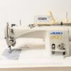 Dixie Tailoring Supply The JUKI DDL 9000 B-SH, a used automatic industrial sewing machine, operates effortlessly on fabric with precision and reliability, making it essential for any tailoring store. Tailoring Supplies