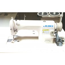 Dixie Tailoring Supply The JUKI DDL 8700 Industrial Sewing Machine, featuring a white body and two thread spools, is perfect for your tailoring store. Tailoring Supplies