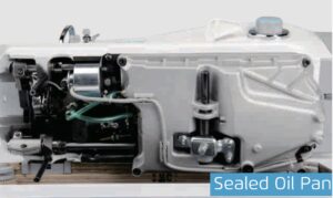 Dixie Tailoring Supply Close-up view of the Jack A6F Automatic Needle Feeding Industrial Sewing Machine’s internal mechanism, highlighting its sealed oil pan and various mechanical components. Tailoring Supplies