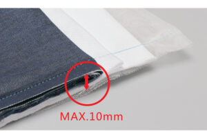 Dixie Tailoring Supply Close-up of fabric layers stacked together near the Jack A2 Auto Thread Cutter Industrial Sewing Machine, with a red arrow and text showing a 10 mm maximum thickness. Tailoring Supplies